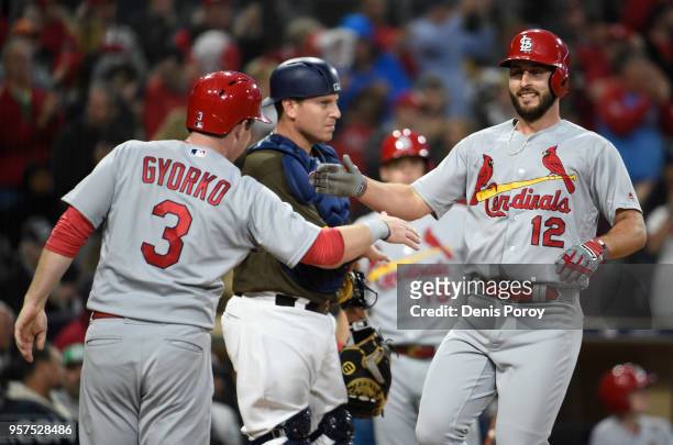 Paul DeJong of the St. Louis Cardinals is congratulated by Jedd Gyorko after hitting a three-run home run during the second inning of a baseball game...