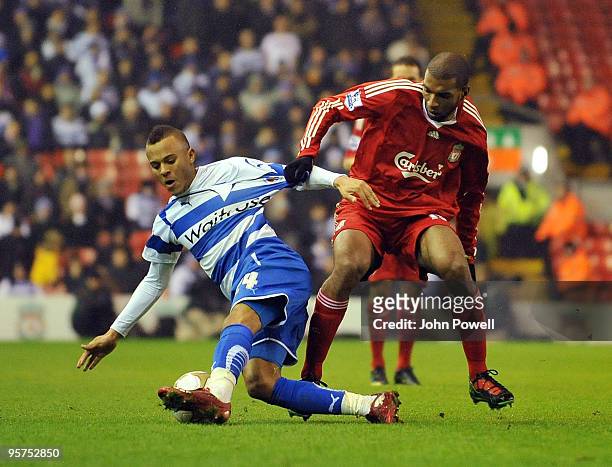 Ryan Babel of Liverpool competes with Ryan Bertrand of Reading during the FA Cup 3rd round replay match between Liverpool and Reading at Anfield, on...
