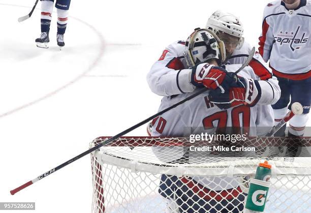 Alex Ovechkin of the Washington Capitals celebrates with his teammate Braden Holtby after defeating the Tampa Bay Lightning in Game One of the...