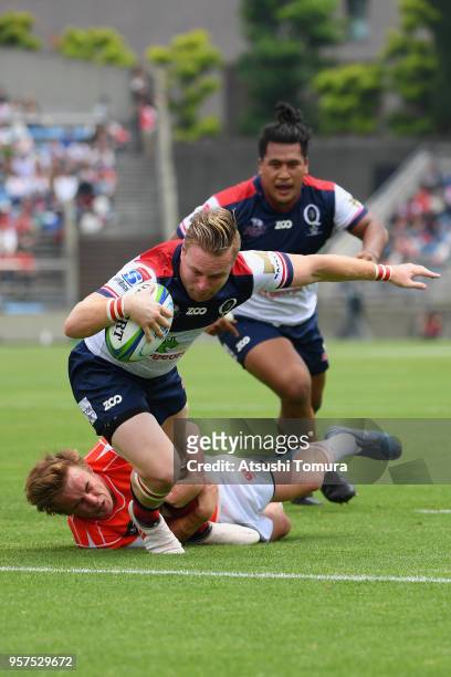 Ben Lucas of the Reds grounds the ball to score his side's second try during the Super Rugby match between Sunwolves and Reds at Prince Chichibu...