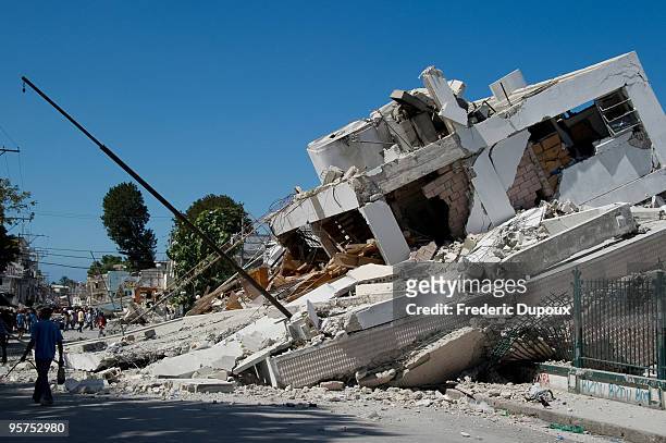 Destroyed building is seen on January 13, 2010 in Port-au-Prince, Haiti. Planeloads of rescuers and relief supplies headed to Haiti as governments...
