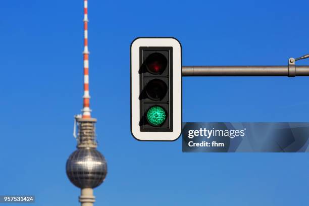television tower berlin with green traffic light (germany) - ampel stock-fotos und bilder