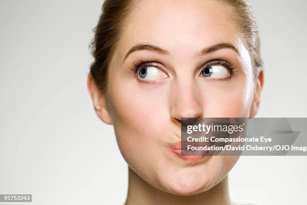 close up of woman puckering her mouth - puckering ストックフォトと画像