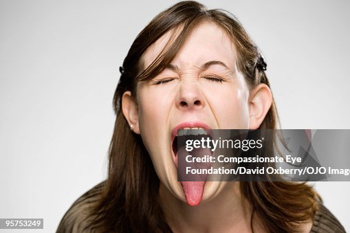 Young woman sticking her tongue out Young woman sticking her tongue out