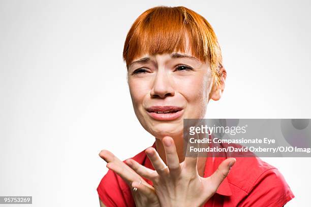 portrait of woman crying - hacer muecas fotografías e imágenes de stock