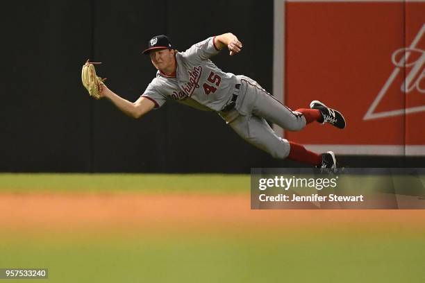 Andrew Stevenson of the Washington Nationals makes a diving catch in the fifth inning of the MLB game against the Arizona Diamondbacks at Chase Field...