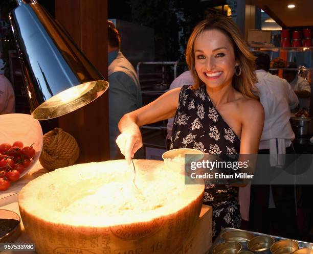 Giada owner and chef Giada De Laurentiis serves spring vegetable risotto during the 12th annual Vegas Uncork'd by Bon Appetit Grand Tasting event...