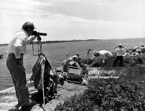 Man takes pictures on the coastline on June 26,1976 in Newport, Rhode Island.