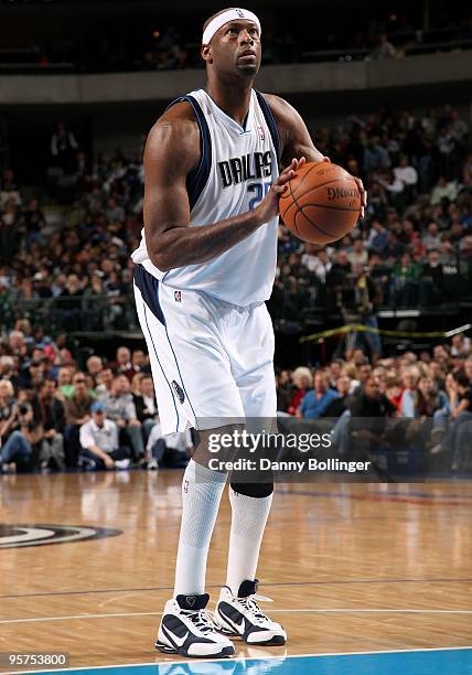 Erick Dampier of the Dallas Mavericks shoots a free throw during the game against the Houston Rockets on December 18, 2009 at American Airlines...