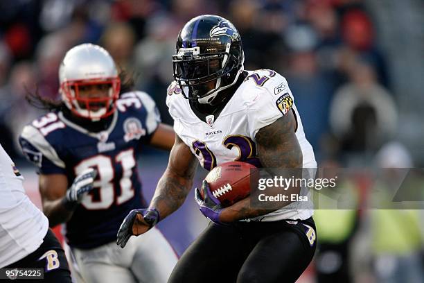 Willis McGahee of the Baltimore Ravens runs the ball against the New England Patriots during the 2010 AFC wild-card playoff game at Gillette Stadium...