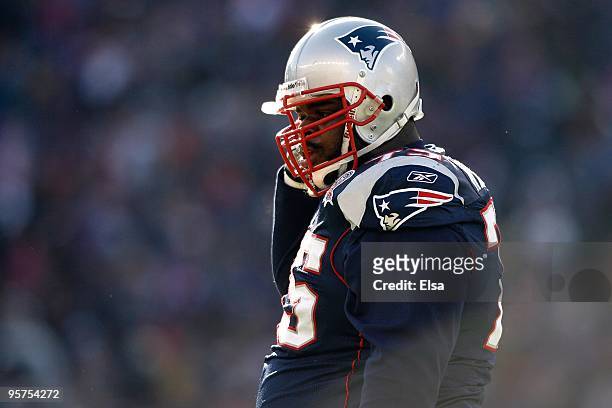 Vince Wilfork of the New England Patriots adjusts his chin strap against the Baltimore Ravens during the 2010 AFC wild-card playoff game at Gillette...