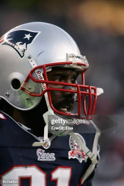 Randy Moss of the New England Patriots looks on against the Baltimore Ravens during the 2010 AFC wild-card playoff game at Gillette Stadium on...