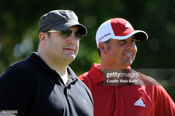 Actor Kevin James , left, and Pat Perez, right, look down the first fairway during the Pro-Am round for the Sony Open in Hawaii held at Waialae...