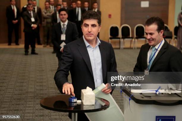 Prime Minister of Iraqi Kurdish Regional Government , Nechirvan Barzani dyes his finger with election ink following casting his vote for the Iraqi...