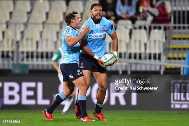 Curtis Rona of the Waratahs is congratulated by Nick Phipps of the Waratahs after scoring a try during the round 12 Super Rugby match between the...