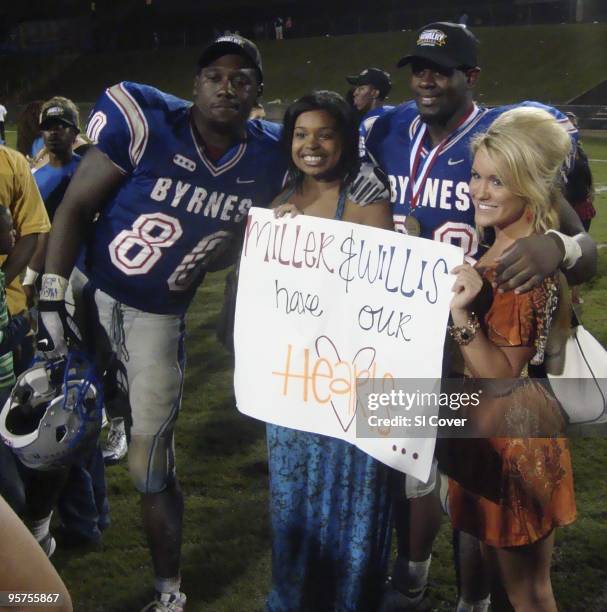Byrnes High Corey Miller and Brandon Willis posing with Tennessee Orange Pride recruiting hostesses Dahra Johnson and Lacey Earps after game vs...