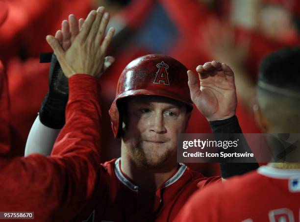 Los Angeles Angels of Anaheim right fielder Kol;e Calhoun in the dugout after scoring on a fly ball in the third inning of a game against the...