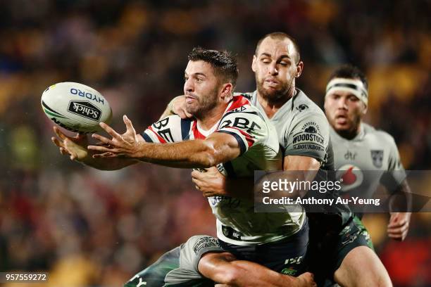 James Tedesco of the Roosters is tackled Simon Mannering of the Warriors during the round 10 NRL match between the New Zealand Warriors and the...