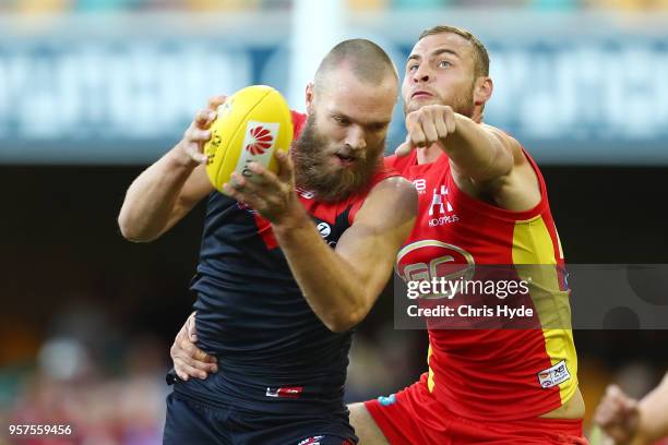 Max Gawn of the Demons takes a mark during the round eight AFL match between the Gold Coast Suns and the Melbourne Demons at The Gabba on May 12,...