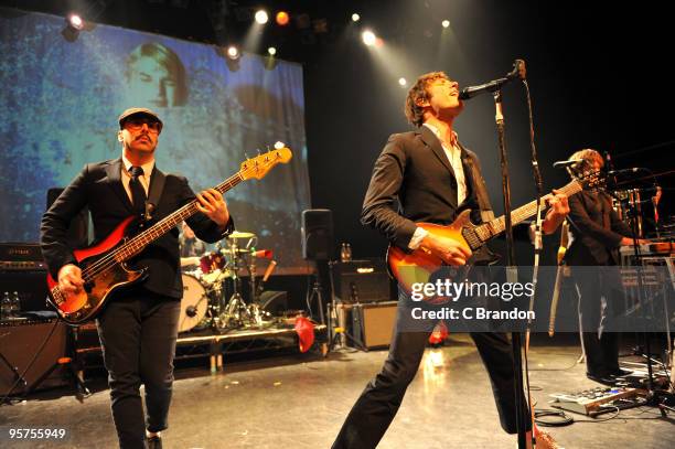 Tim Norwind, Damian Kulash and Andy Ross of OK Go perform on stage at Shepherds Bush Empire on January 13, 2010 in London, England.