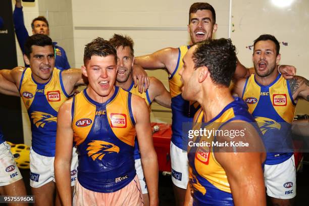 Brayden Ainsowrth and Brendan Ah Chee of the Eagles and their team mates sing the team song as they celebrate victory during the round eight AFL...