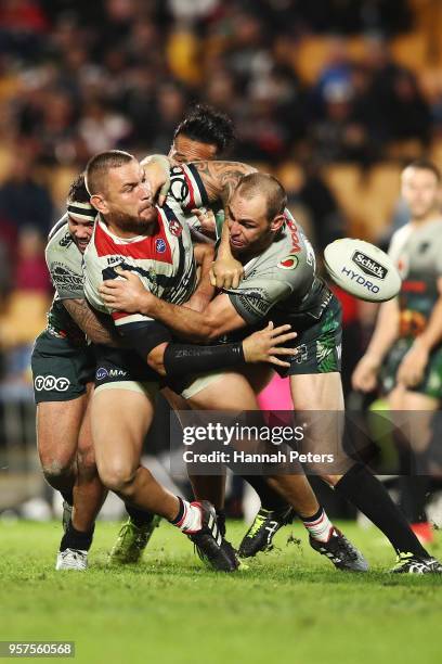 Jared Waerea-Hargreaves of the Roosters offloads the ball during the round 10 NRL match between the New Zealand Warriors and the Sydney Roosters at...