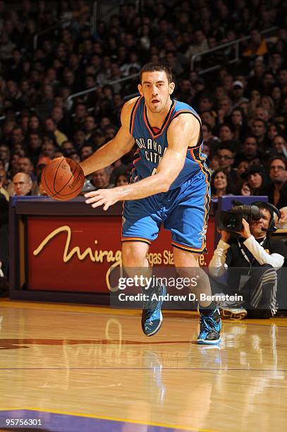 Nick Collison of the Oklahoma City Thunder moves the ball up court during the game against the Los Angeles Lakers at Staples Center on December 22,...