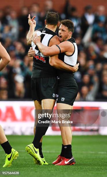 Paddy Ryder of Port Adelaide and Travis Boak captain of Port Adelaide celebrates their first goal during the round eight AFL match between the Port...