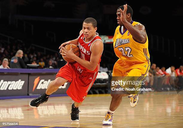 Jonathan Wallace of the Rio Grande Valley Vipers drives against Frank Robinson of the Los Angeles D-Fenders during the D-League game on January 3,...