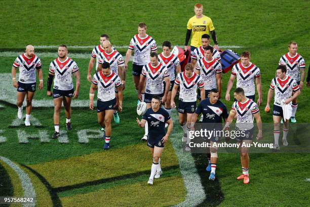 Cooper Cronk of the Roosters walks the team back to the dressing room prior to the round 10 NRL match between the New Zealand Warriors and the Sydney...