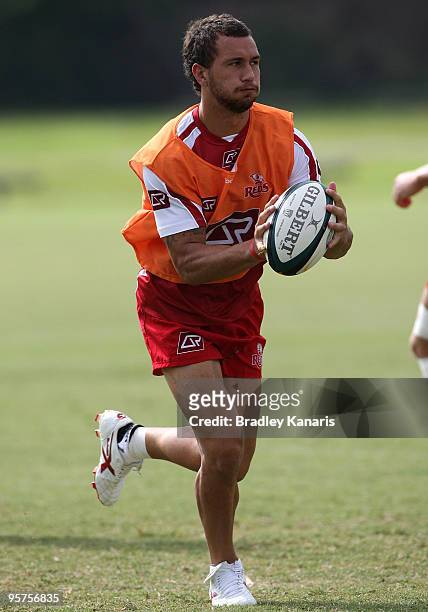 Quade Cooper runs with the ball during a Reds Super 14 training session at Ballymore Stadium on January 14, 2010 in Brisbane, Australia.