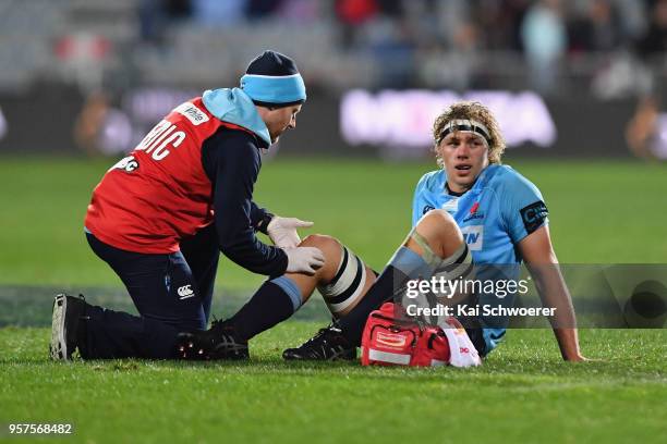 Ned Hanigan of the Waratahs receives medical help during the round 12 Super Rugby match between the Crusaders and the Waratahs at AMI Stadium on May...