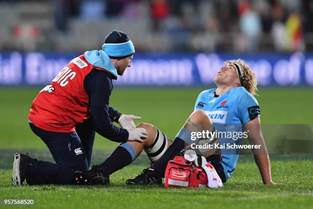 Ned Hanigan of the Waratahs receives medical help during the round 12 Super Rugby match between the Crusaders and the Waratahs at AMI Stadium on May...