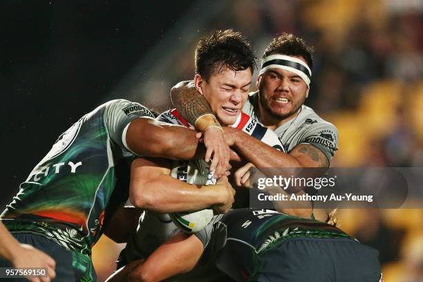 Joseph Manu of the Roosters is tackled Jazz Tevaga of the Warriors during the round 10 NRL match between the New Zealand Warriors and the Sydney...