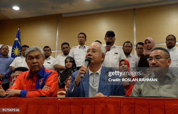 Former Malaysian prime minister Najib Razak attends a press conference announcing his resignation as president of the United Malays National...