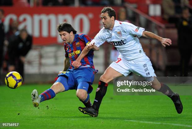 Lionel Messi of Barcelona shoots at goal before being challenged by Fernando Navarro of Sevilla during the last 16, second leg Copa del Rey match...