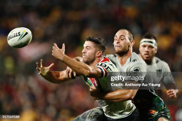 James Tedesco of the Roosters is tackled Simon Mannering of the Warriors during the round 10 NRL match between the New Zealand Warriors and the...