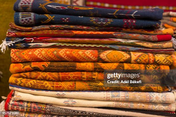 carpets for sale in carpet shop in the medina. (morocco) - dirham stock pictures, royalty-free photos & images