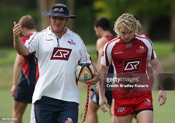 Coach Ewen McKenzie talks with Ben Lucas during a Reds Super 14 training session at Ballymore Stadium on January 14, 2010 in Brisbane, Australia.