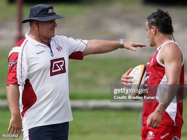 Coach Ewen McKenzie gives instructions to Richard Kingi during a Reds Super 14 training session at Ballymore Stadium on January 14, 2010 in Brisbane,...