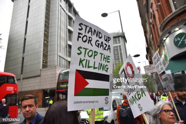 Pro-Palestine demonstrators gather outside the Embassy of Israel in Kensington, to commemorate the 70th anniversary of the Palestinian Exodus, known...