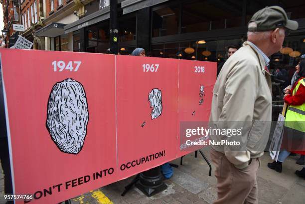 Pro-Palestine demonstrators gather outside the Embassy of Israel in Kensington, to commemorate the 70th anniversary of the Palestinian Exodus, known...