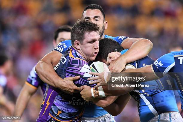 Ryan Hoffman of the Storm is tackled during the round ten NRL match between the Melbourne Storm and the Gold Coast Titans at Suncorp Stadium on May...