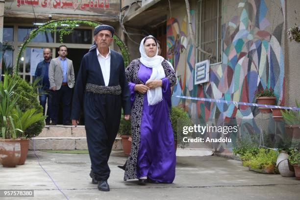 Iraqi people arrive to cast their vote at a polling station for the Iraqi parliamentary election in Sulaymaniyah, Iraq on May 12, 2018.