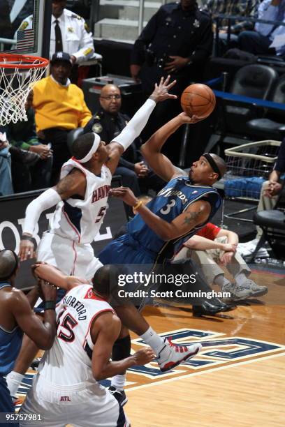 Caron Butler of the Washington Wizards puts up a shot against Josh Smith of the Atlanta Hawks on January 13, 2010 at Philips Arena in Atlanta,...