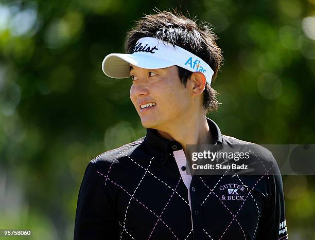 Ryuji Imada waits for play from the first tee box during the Pro-Am round for the Sony Open in Hawaii held at Waialae Country Club on January 13,...