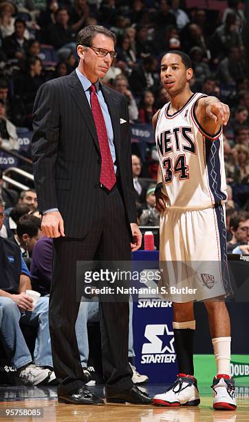 Devin Harris of the New Jersey Nets speaks to head coach Kiki Vandeweghe during game against the Boston Celtics on January 13, 2010 at the IZOD...