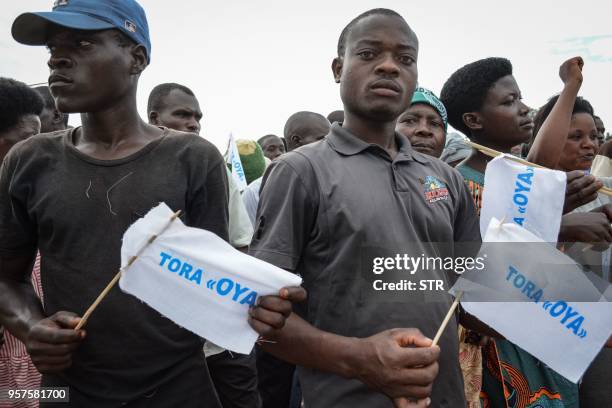 People hold banners written "Vote No" in local language Kirundi during the opposition's campaign against the referendum for the constitutional...