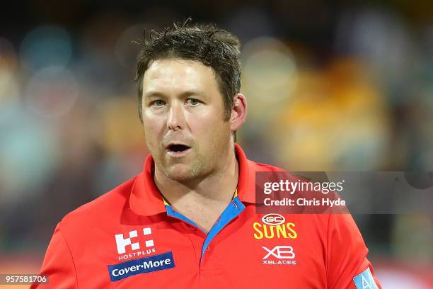 Suns coach Stuart Dew looks on during the round eight AFL match between the Gold Coast Suns and the Melbourne Demons at The Gabba on May 12, 2018 in...