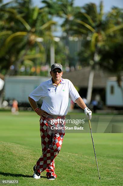 John Daly waits for play at the first fairway during the Pro-Am round for the Sony Open in Hawaii held at Waialae Country Club on January 13, 2010 in...